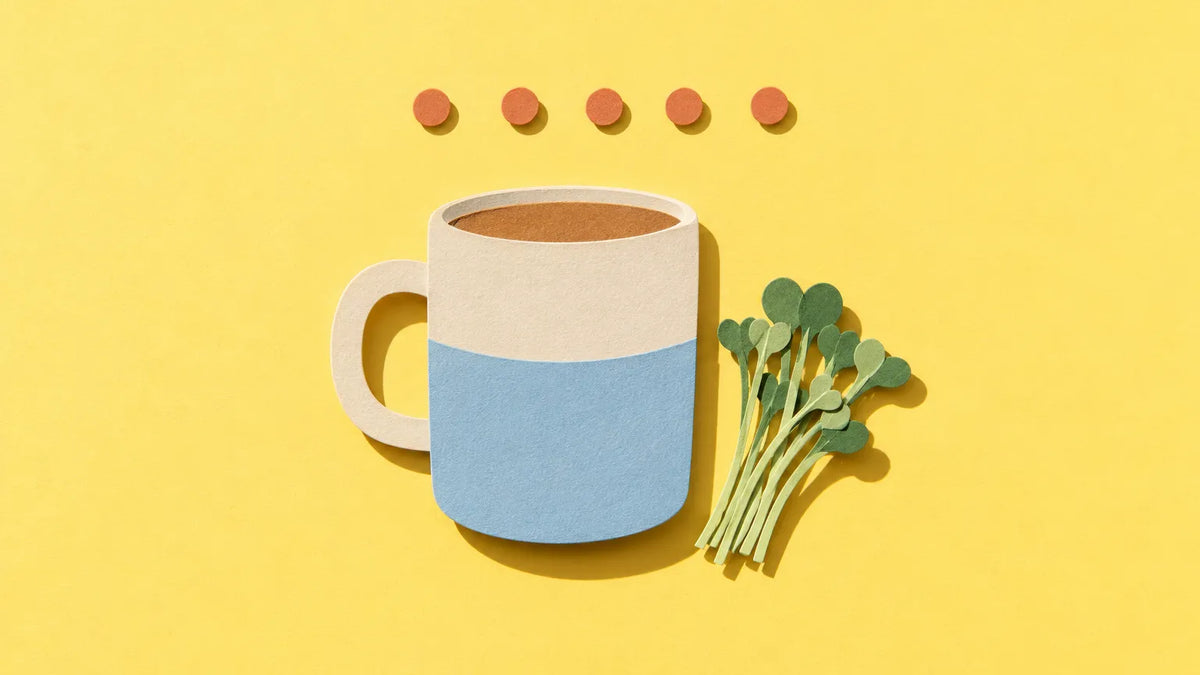 Paper-cut illustration of a mug beside a sprig of broccoli sprouts